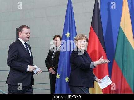Berlin, Germany. 23rd Feb, 2017. German Chancellor Angela Merkel (R) and visiting Lithuanian Prime Minister Saulius Skvernelis arrive for a joint press conference in Berlin, capital of Germany, on Feb. 23, 2017. Credit: Shan Yuqi/Xinhua/Alamy Live News Stock Photo