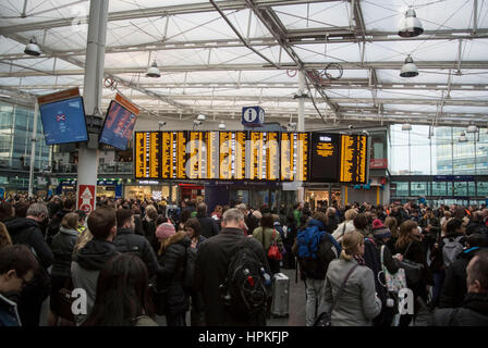 Manchester, UK. 23rd Feb, 2017. Storm Doris ‘Weather bomb' causes severe delays on all trains from Manchester Piccadilly rail station. Commuters warned of cancelled and delayed services as 'all lines are blocked' following 'overhead wire problems'. Departure boards shows severely delayed services. Credit: Bailey-Cooper Photography/Alamy Live News Stock Photo