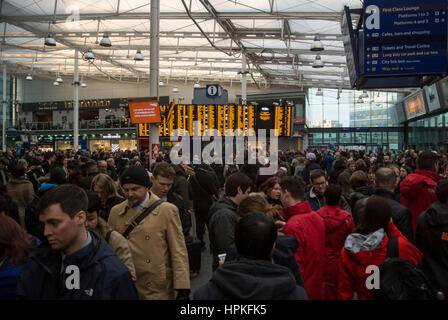 Manchester, UK. 23rd Feb, 2017. Storm Doris ‘Weather bomb' causes severe delays on all trains from Manchester Piccadilly rail station. Commuters warned of cancelled and delayed services as 'all lines are blocked' following 'overhead wire problems'. Departure boards shows severely delayed services. Credit: Bailey-Cooper Photography/Alamy Live News Stock Photo