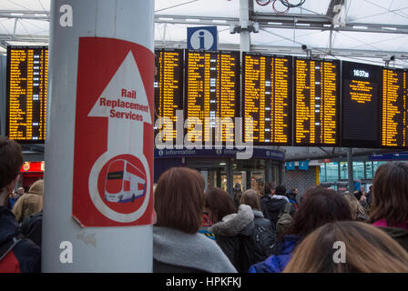 Manchester, UK. 23rd Feb, 2017. Storm Doris ‘Weather bomb' causes severe delays on all trains from Manchester Piccadilly rail station. Commuters warned of cancelled and delayed services as 'all lines are blocked' following 'overhead wire problems'. Departure boards shows severely delayed services. Credit: Bailey-Cooper Photography/Alamy Live News Stock Photo