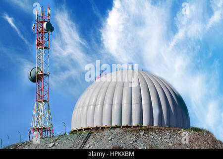 radar dome technology on the background of blue clouds Stock Photo