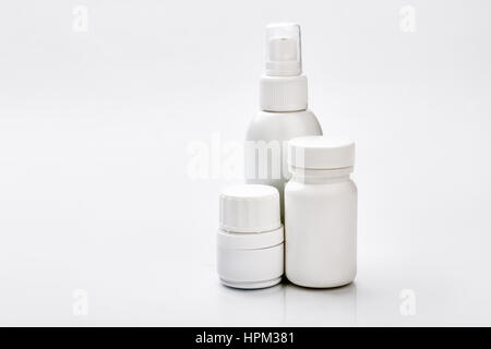 White plastic containers for pills. Stock Photo