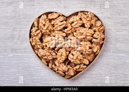 Walnuts in a heart-shaped box. Stock Photo