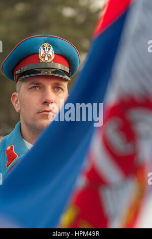 Serbian Armed Forces / Serbian Army Guards brigade [Garda]  officer portrait raising national flag during ceremony in Belgrade Stock Photo