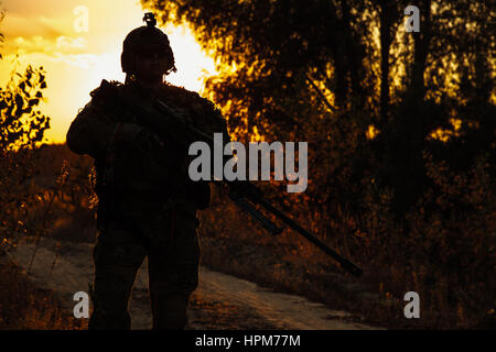 Army sniper with large caliber rifle Stock Photo