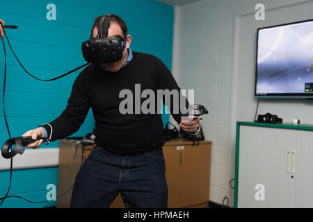 A man using a virtual reality - or VR - headset Stock Photo
