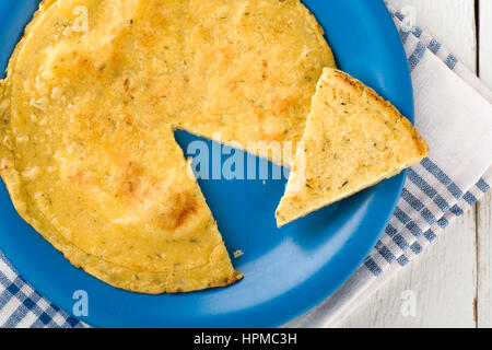 Sliced Vegan Chickpea Omelette on Blue Dish Stock Photo