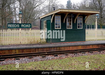 Old retro vintage style railway or railroad stop on a narrow gauge train track Stock Photo