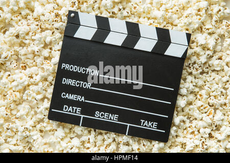 Clapperboard and popcorn. Top view. Stock Photo