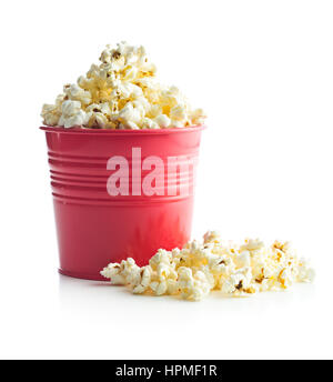 Tasty popcorn in red cup isolated on white background. Stock Photo