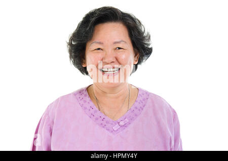 Portrait of Asian senior adult woman smiling, isolated on white background. Stock Photo