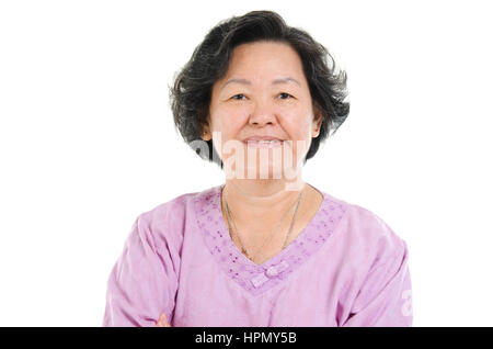 Portrait of 60s Asian senior adult woman smiling, isolated on white background. Stock Photo