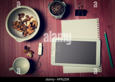 Delicacies in mortar, flat lay view. Nuts, hacelnuts, raisins, almonds. Copyspace. Stock Photo