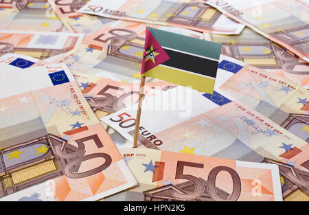 Flag of Mozambique sticking in european banknotes.(series) Stock Photo