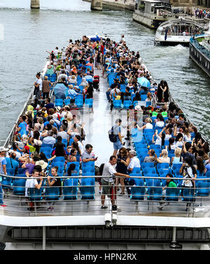 Tourist boat with blue chairs on the river Seine in Paris, France Stock Photo