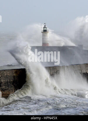 Waves crash over the lighthouse in Newhaven, East Sussex, as flights have been cancelled and commuters were warned they faced delays after Storm Doris reached nearly 90mph on its way to batter Britain. Stock Photo