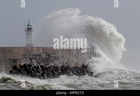 Waves crash over the lighthouse in Newhaven, East Sussex, as flights have been cancelled and commuters were warned they faced delays after Storm Doris reached nearly 90mph on its way to batter Britain. Stock Photo