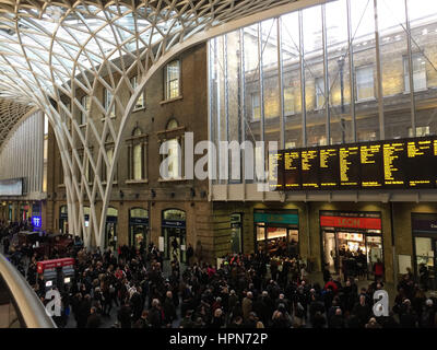 Commuters waiting at King's Cross Station in London, as flights have been cancelled and commuters were warned they faced delays after Storm Doris reached nearly 90mph on its way to batter Britain. Stock Photo