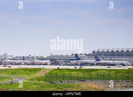 Washington DC, USA - May 3, 2015: Aircrafts of American Airlines and US Airways in the movement area of Ronald Reagan National Airport seen from Grave Stock Photo