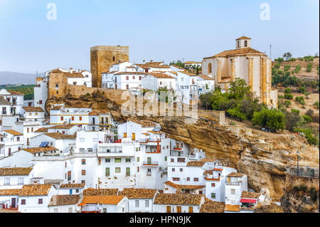 village Setenil de las Bodegas; white houses under rocks, province of Cádiz, Andalusia, Spain Stock Photo
