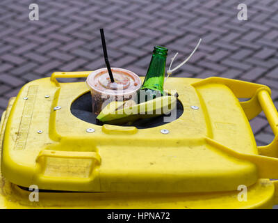 Garbage spilling over from a dustbin in downtown Amsterdam, Netherlands Stock Photo