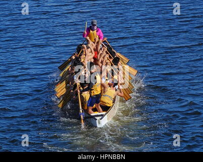 KAOHSIUNG, TAIWAN -- MAY 27, 2016: An unidentified team trains on the Love River in preparation for the upcoming Dragon Boat Festival. Stock Photo