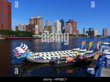 KAOHSIUNG, TAIWAN -- MAY 27, 2016: Workers transport barges on the Love River in preparation for the upcoming Dragon Boat Festival. Stock Photo
