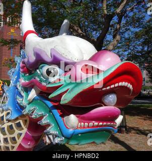 KAOHSIUNG, TAIWAN -- MAY 27, 2016: The dragon shaped figurehead of a traditional dragon boat is being prepared for the upcoming Dragon Boat Festival. Stock Photo