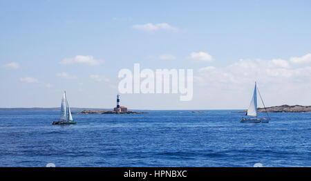 Sailing boats approaching  Sant Francesc Xavier Fomentera  Spain Stock Photo