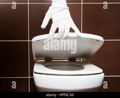 White clean toilet with open seat cover after repairs Stock Photo