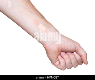 Bandaid on injury on hand isolated on white background Stock Photo