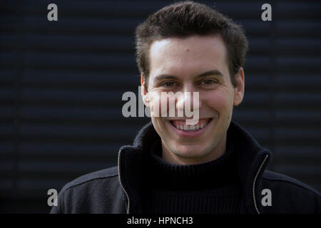 portrait of a young man in black jacket Stock Photo