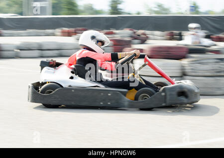 Karting driver motion blued Stock Photo