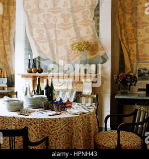 A dining room with a fireplace. Stock Photo
