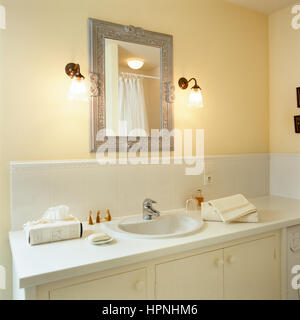 A bathroom sink with a mirror. Stock Photo