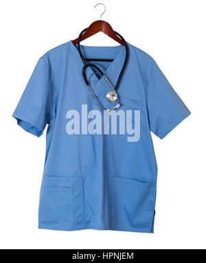 Blue medical scrubs uniform shirt hanging on a hanger with stethoscope and isolated against white background Stock Photo