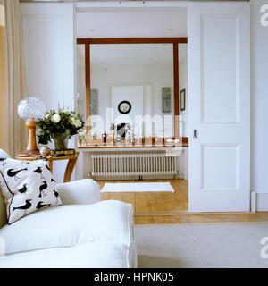 A sofa outside of a bathroom. Stock Photo