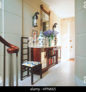 A side table in a foyer. Stock Photo