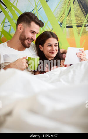 Couple spend pleasant free time in bed in the morning Stock Photo