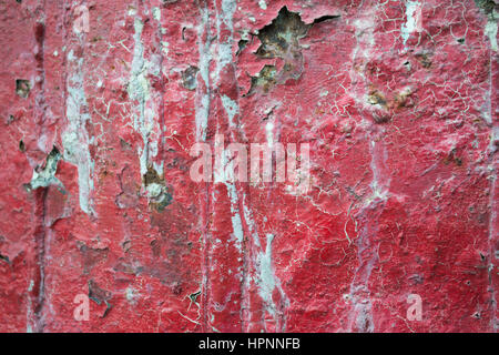 Red Cracked Paint on Wall Stock Photo