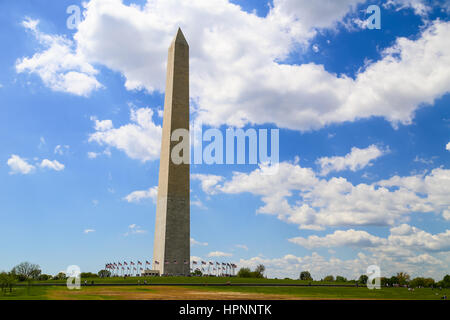 Washington DC, USA - May 2, 2015: The Washington Monument on the National Mall in Washington DC, with blue sky and some clouds. Stock Photo