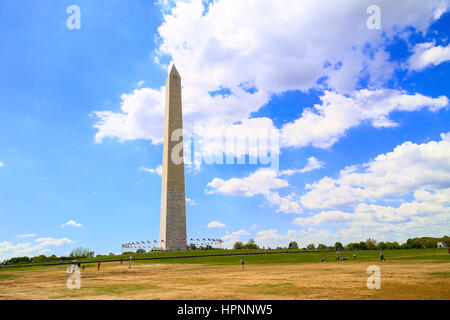 Washington DC, USA - May 2, 2015: The Washington Monument on the National Mall in Washington DC, with blue sky and some clouds. Stock Photo