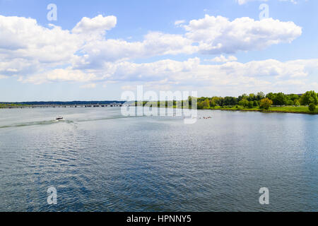 Washington DC, USA - May 2, 2015: The Potomac River in Washington DC with some canoes and boats and the 14th Street Bridge in the back. Stock Photo