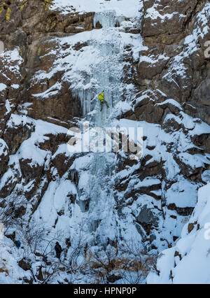Elijah Weber climbs a route called Hidden Falls Rated WI3+ near Marsing Idaho Stock Photo