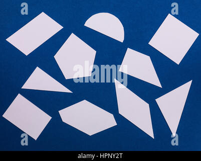 Random Pattern of Geometric Shapes on a Blue Background Stock Photo