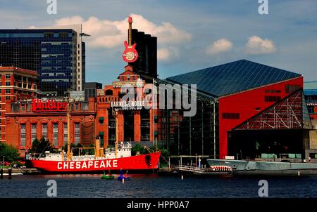 Baltimore, Maryland - July 22, 2013:  The Lightship Chesapeake moored in front of the Power Plant commercial complex and the ultra-modern National Aqu Stock Photo