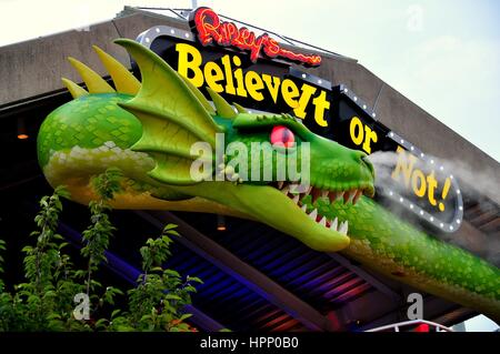 Baltimore, Maryland - July 22, 2013: Smoke emannates from the nostrils of a giant green dragon snaked over the entrance to the Ripley's Believe It or  Stock Photo
