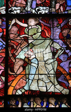 Stained glass representing the devil chained, detail of the canopy of the low-side South of the nave. Our Lady of Strasbourg Cathedral. Strasbourg. Stock Photo