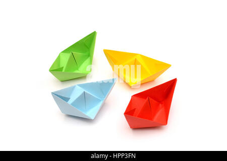 Colored paper boats, origami isolated on white background Stock Photo