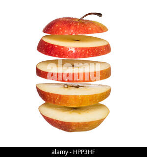 Flying apple. Sliced red apple isolated on white background. Levity fruit floating in the air Stock Photo